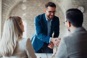 Business people shaking hands in the office.